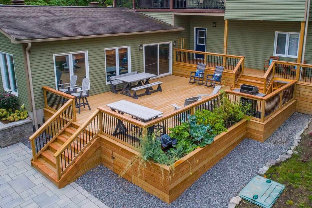 Two sets of deck stairs connect a family’s home to a fabulous outdoors living room.