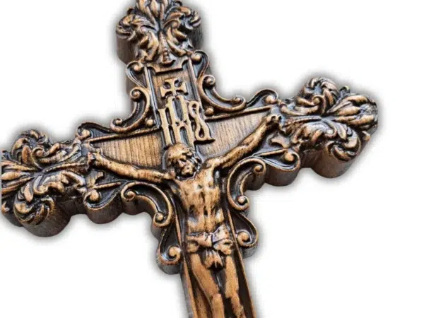 Close up top view of intricate wood carved crucifix